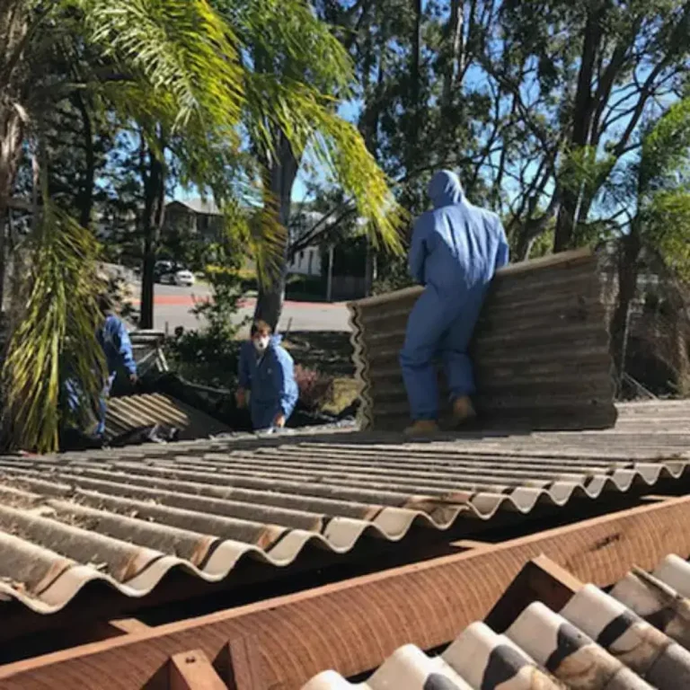 3 asbestos removalist on the roof of a residential removing the asbestos