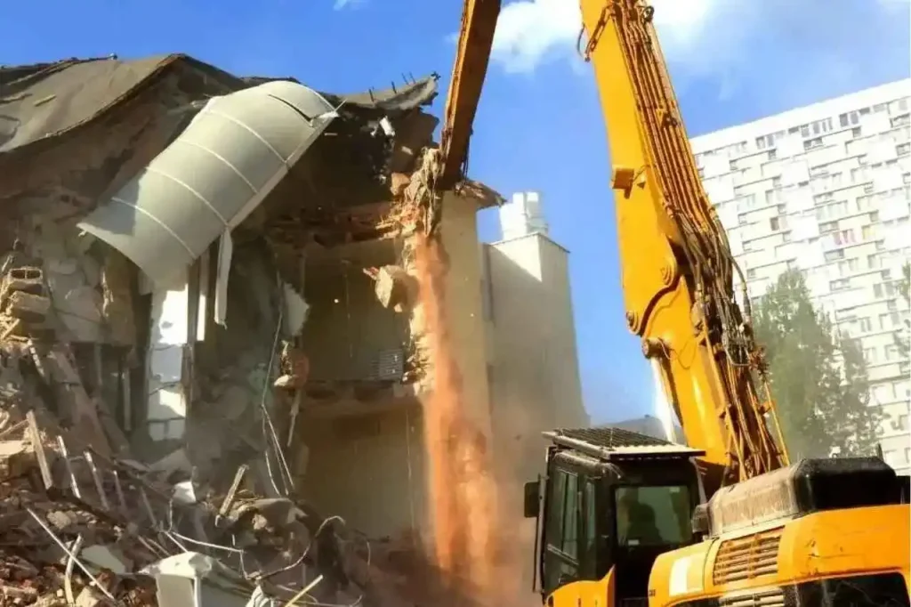Excavator demolishing a commercial building in Sydney