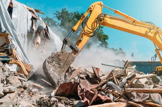 An excavator demolishing a house in Sydney